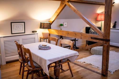 a dining room with a table and chairs at The Garret in Salisbury