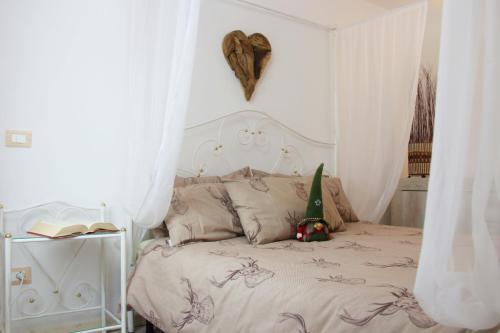 En eller flere senger på et rom på Vacanze Val di Non - Appartamento Passo della Mendola