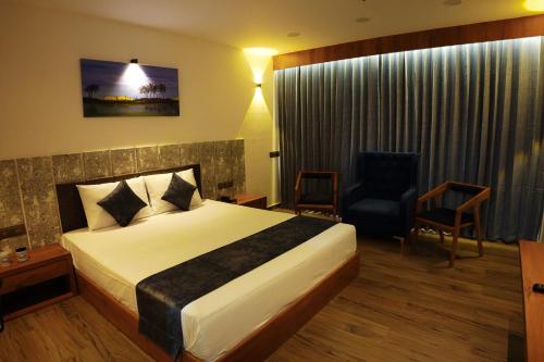 Katil atau katil-katil dalam bilik di Clarks Safari Kheda, Ahmedabad