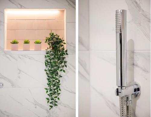 a bathroom sink with a plant on a shelf at The Milton sleeps 8 close to York city centre pet friendly in York