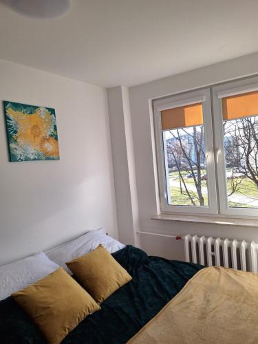 Llit o llits en una habitació de MiniApart Grunwaldzka