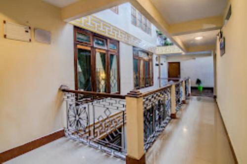 an empty hallway of a building with a balcony at Hotel Muscatel BhumSang Darjeeling in Darjeeling