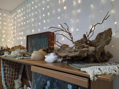 a table with christmas lights and antlers on it at L'amuri du mare in Trapani