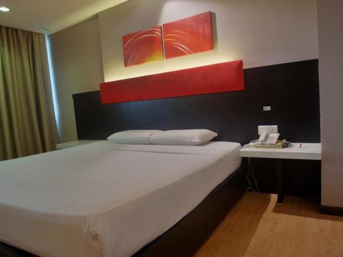 Red Rock Hotel Penangにあるベッド