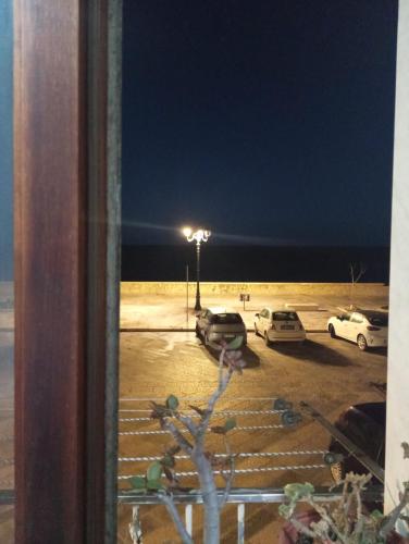 a view of a parking lot at night at L'amuri du mare in Trapani