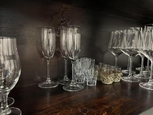 a group of wine glasses sitting on a table at Le Ghie in Mondovì