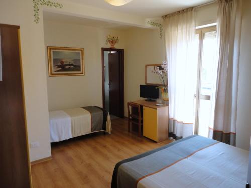 Katil atau katil-katil dalam bilik di Hotel Mariani