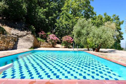 a swimming pool in a yard with trees at Casas Rurales Cortijo El Marqués in Quesada