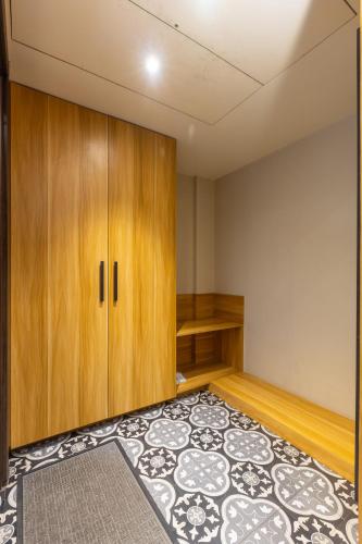 an empty room with a cabinet and a rug at Kohsa7 in Gurgaon