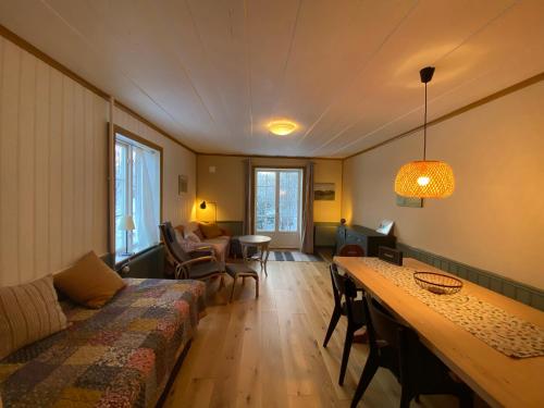 a living room with a couch and a table at Per-Sims in Ljusdal