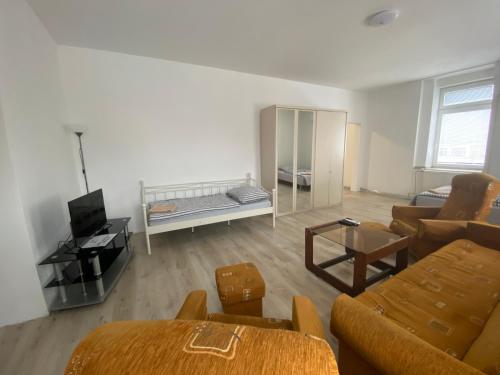 TV a/nebo společenská místnost v ubytování Apartmány Pražská