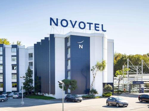 a novation sign on the front of a building at Novotel Valence Sud in Valence