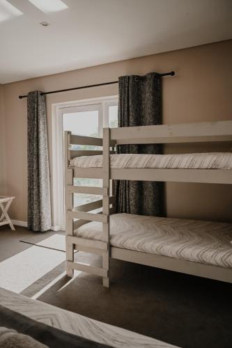 Cama o camas de una habitación en Gecko Lodge