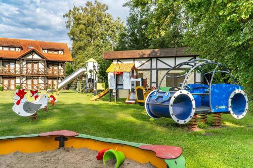 a park with a playground with a slide at Stonka in Chłopy