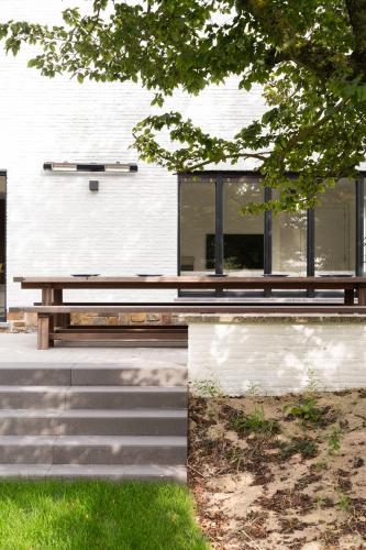 a wooden bench sitting in front of a building at Bunker 155 in Ostend