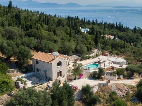 an aerial view of a villa with a swimming pool at Villa Bolios Sea view Private Pool in Matsoukáta