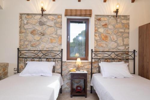 Кровать или кровати в номере Villa Bolios Sea view Private Pool