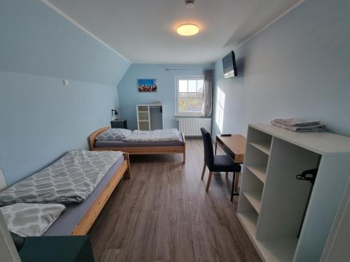 Ένα ή περισσότερα κρεβάτια σε δωμάτιο στο Dat Diekhus