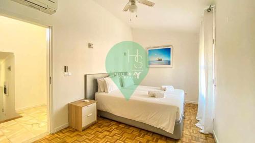a bedroom with a bed with a heart sign on it at Vila Shradhala V4 Vilamoura Marina by HsRentals in Vilamoura