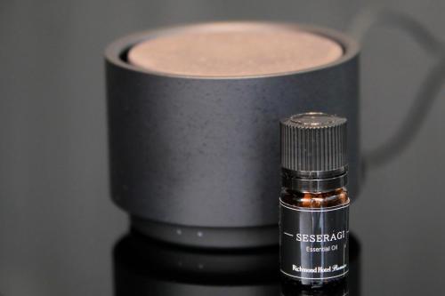 a bottle of essential oil sitting next to a container at Richmond Hotel Premier Kyoto Shijo in Kyoto