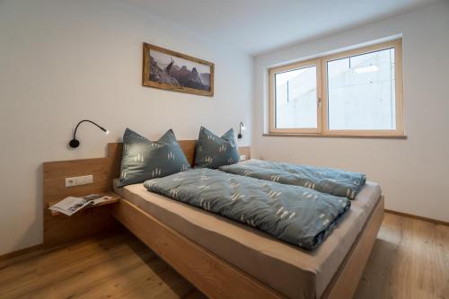 מיטה או מיטות בחדר ב-Apart Ausblick