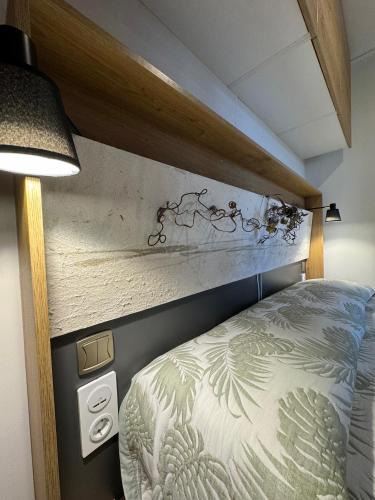 a bed in a room with a wall at Palazzo delle Biscie - Old Tower & Village in Molinella