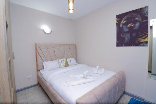 Llit o llits en una habitació de The Sleek Spaces