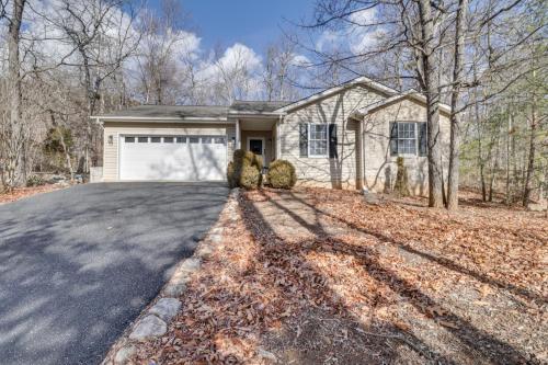 a house with a driveway with a garage at McGaheysville Vacation Rental, 1 Mi to Skiing! in McGaheysville