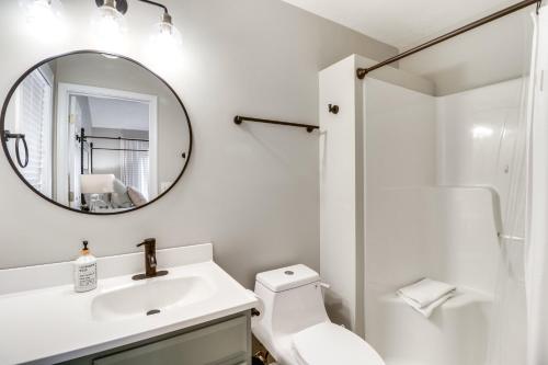 a white bathroom with a sink and a mirror at McGaheysville Vacation Rental, 1 Mi to Skiing! in McGaheysville