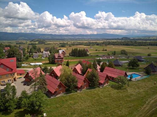 an aerial view of a small village with red roofs at Ośrodek Wczasowy Groń Placówka in Groń