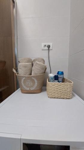 two baskets sitting on a counter in a kitchen at MINA modern & cozy apartment main city square GTC Skopje in Skopje