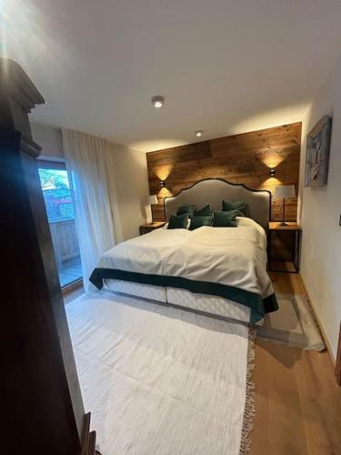 Кровать или кровати в номере Spa, Sport & City Luxury Ski-in Ski-Out Apartment