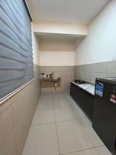 Η κουζίνα ή μικρή κουζίνα στο Alstenor Homestay