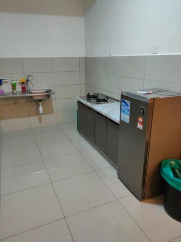 Η κουζίνα ή μικρή κουζίνα στο Alstenor Homestay