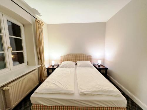 Letto o letti in una camera di Schloss Lüdersburg Golf & Spa