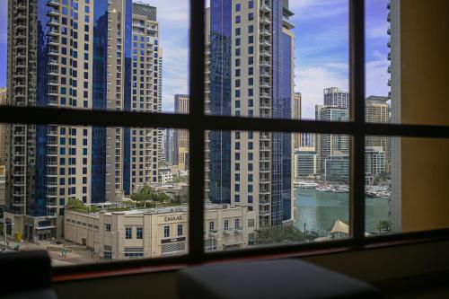 a view of a city skyline from a window at The W Jumeirah Beach in Dubai