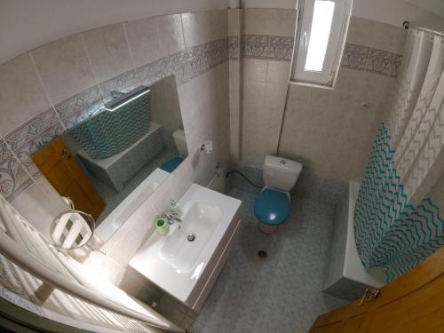 an overhead view of a bathroom with a sink and a shower at Scala Room 68 in Ioannina