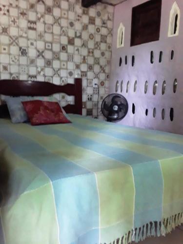 Säng eller sängar i ett rum på hostel kay pacha