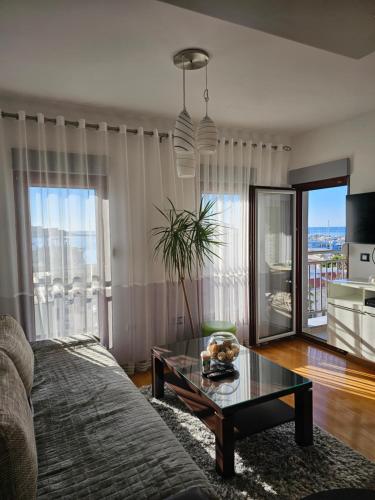 a living room with a couch and a table at Beki Apartment in Bar