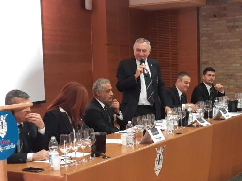 a group of people sitting at a table with a microphone at Bes Hotel Bergamo Cologno al Serio in Cologno al Serio