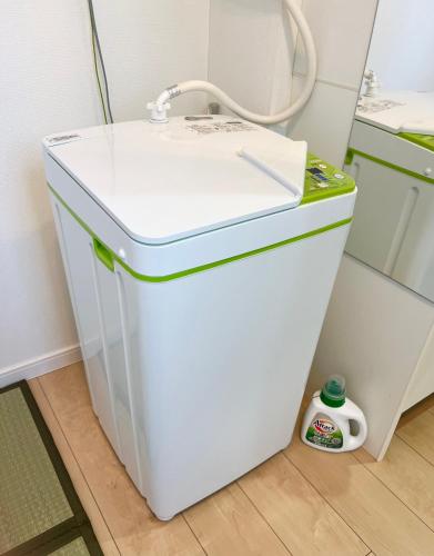 a small white refrigerator with a sink in a room at Koenji loft apartment/Shinjuku&Kichijoji/JR in Tokyo