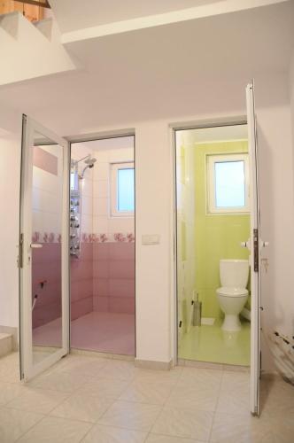 a bathroom with a shower and a toilet at Guest House Bojana in Troyan