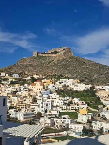a view of a town with a castle on a hill at La Scaletta Guest House in Spilia Leros in Panteli