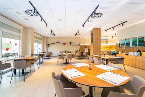 a dining room with tables and chairs at Vistamar Hotel Luxury Wellness By DLV -Adults Only- in Villajoyosa