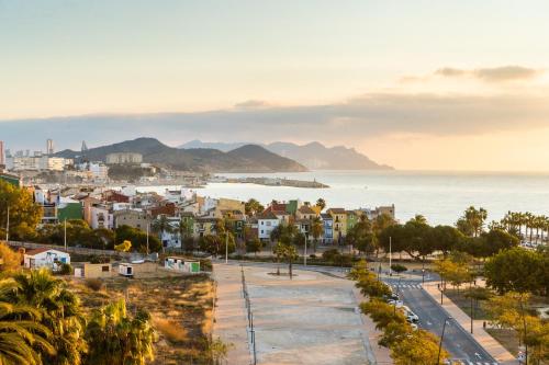 a view of a city and the ocean at Vistamar Hotel Luxury Wellness By DLV -Adults Only- in Villajoyosa