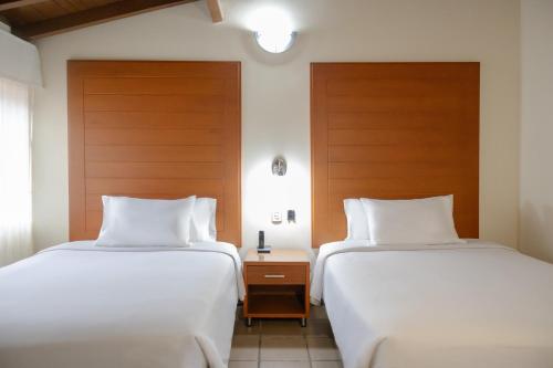 Uma cama ou camas num quarto em Hotel Faranda Bolivar Cucuta, a member of Radisson Individuals