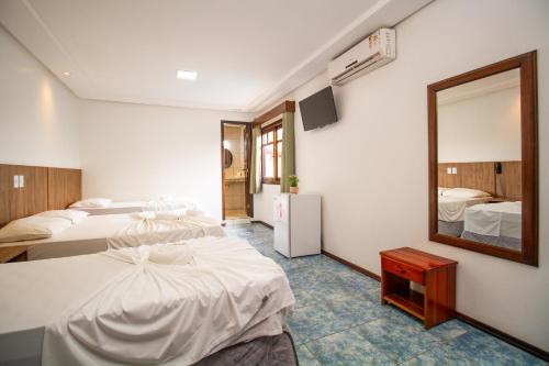 Cama ou camas em um quarto em Hotel Bem Brasil