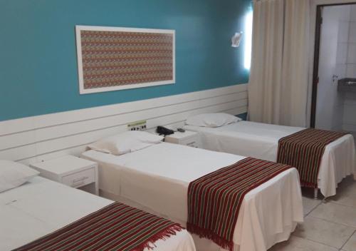 Ένα ή περισσότερα κρεβάτια σε δωμάτιο στο Hotel Sol Nascente