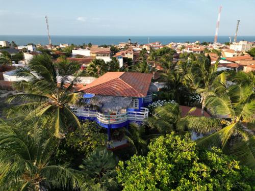 an aerial view of a city with palm trees at Charming blue house with kitchen parking and garden in Canoa Quebrada