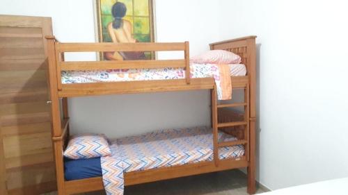 a couple of bunk beds in a room at TrevizZo Genipabu Natal! in Natal